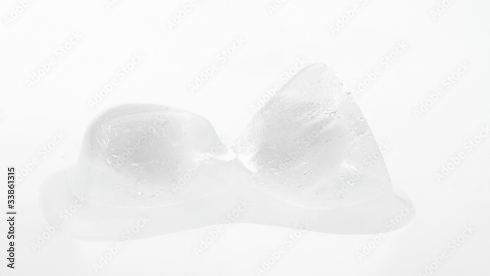 Two melting ice cubes on white, time lapse video