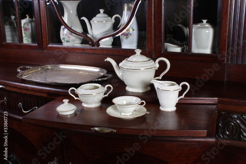 Tea set on the old chest of drawers