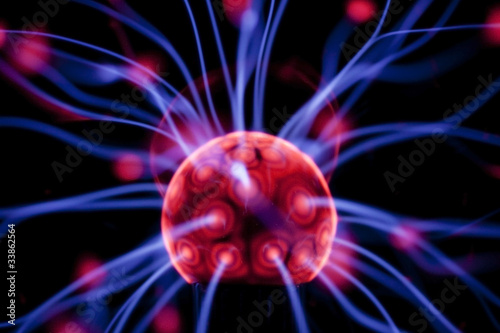 Plasma ball with colorful patterns on black background.