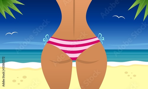 Sexy woman on the beach near a sea