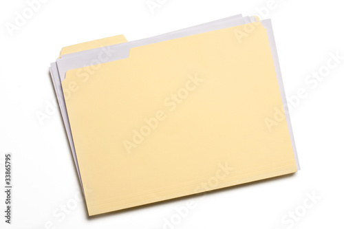 Documents stuffed in Manila folder isolated on white photo