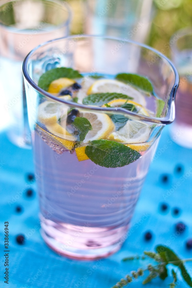 Summer softdrink with lemon, berries and mint Summer softdrink with lemon, berries and mint