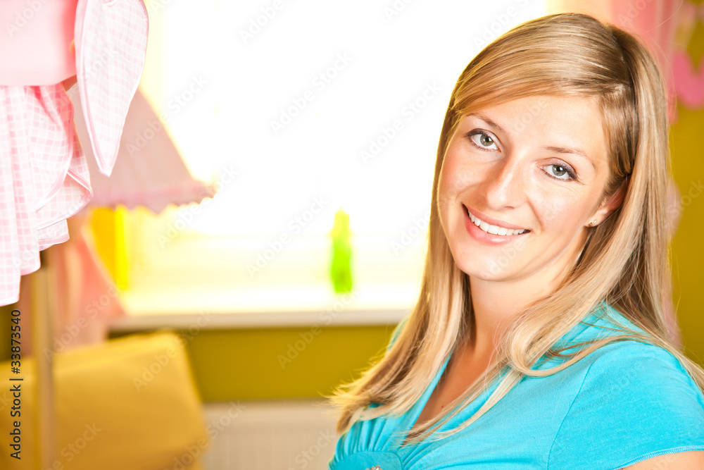 Pregnant woman in baby room Pregnant woman in baby room