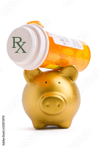 Piggy bank lifting a prescription medicine bottle on white