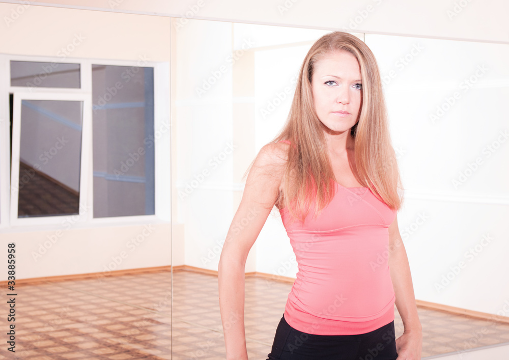 Sporty woman in the training room alone