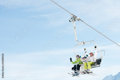 Fotografia Winter  vacation, family on ski lift - space for text