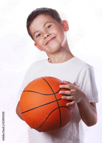 boy has ball for game in basketball isolated on white