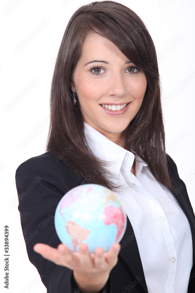 Portrait of a young woman holding a globe Portrait of a young woman holding a globe
