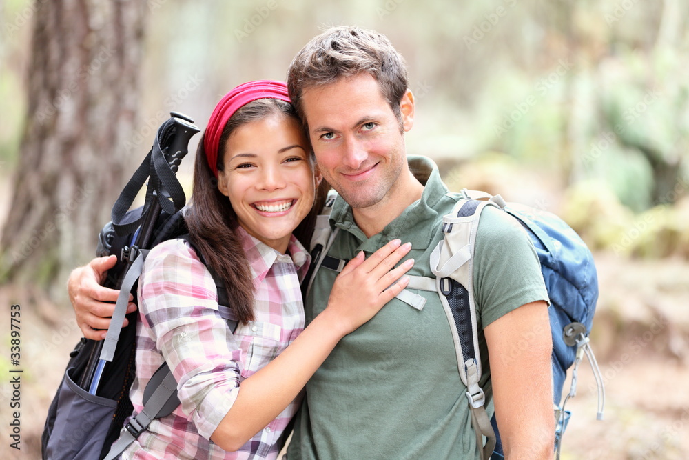Happy young couple hiking Happy young couple hiking