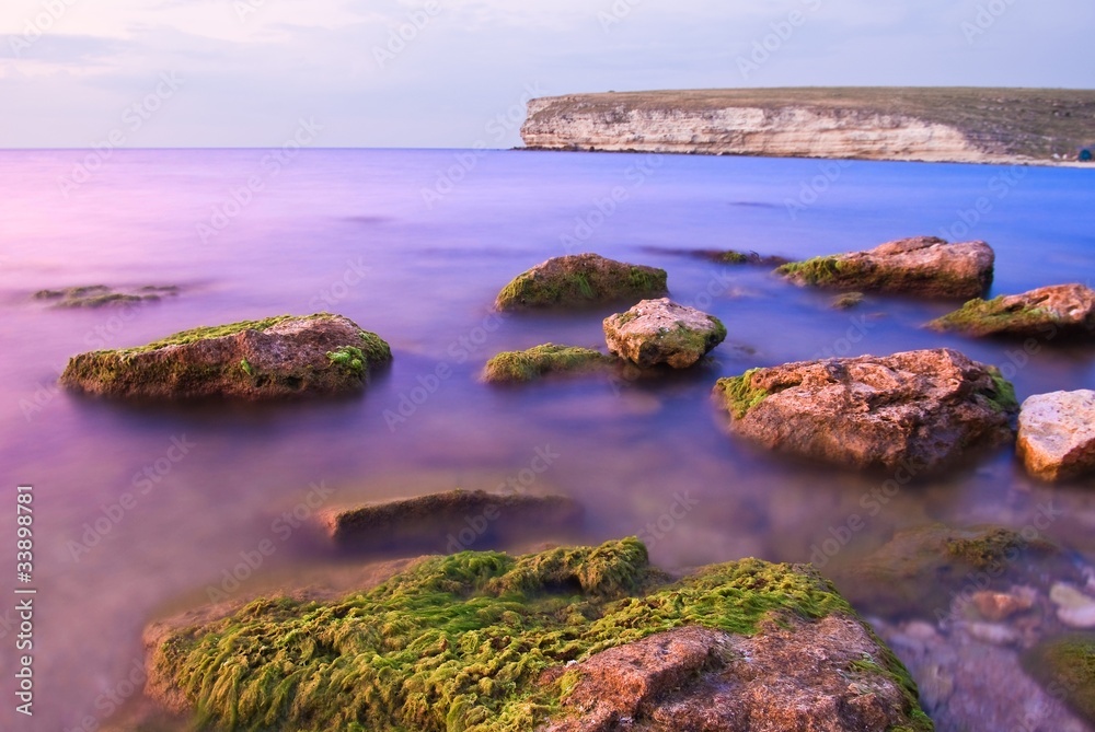 Obraz premium stones in a evening sea