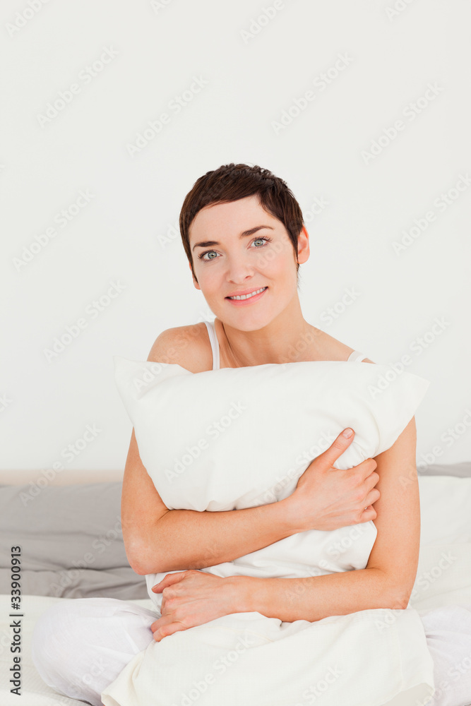 Portrait of a woman holding a pillow Portrait of a woman holding a pillow