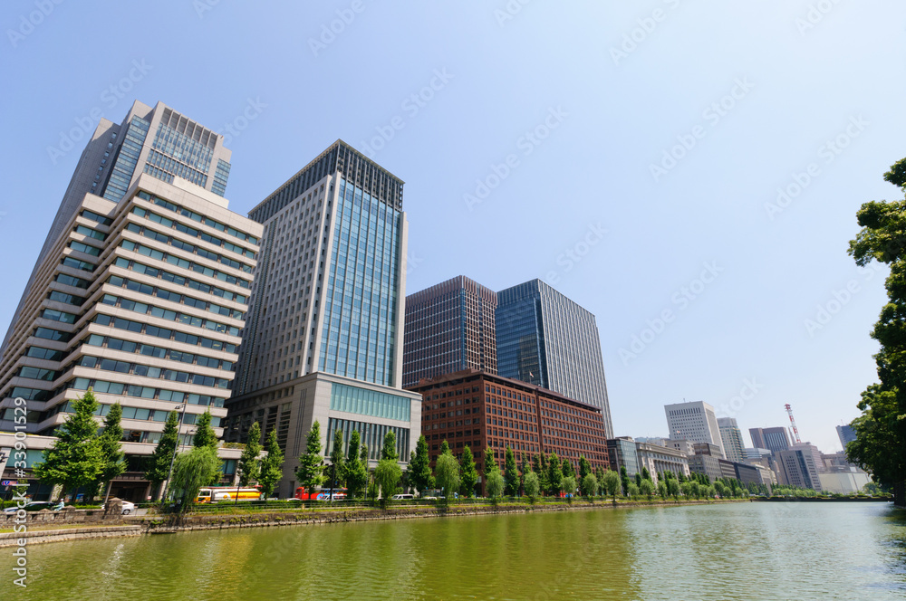 Moat of the imperial palace and Skyscrapers in Tokyo, Japan