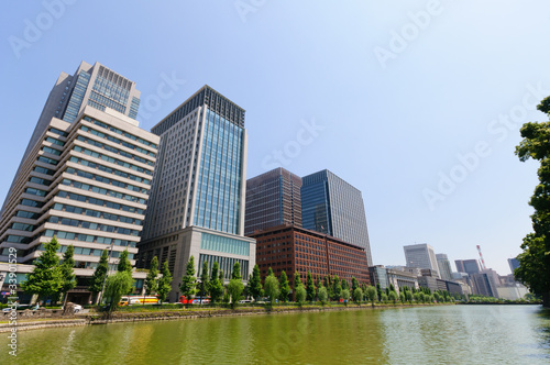 Moat of the imperial palace and Skyscrapers in Tokyo  Japan