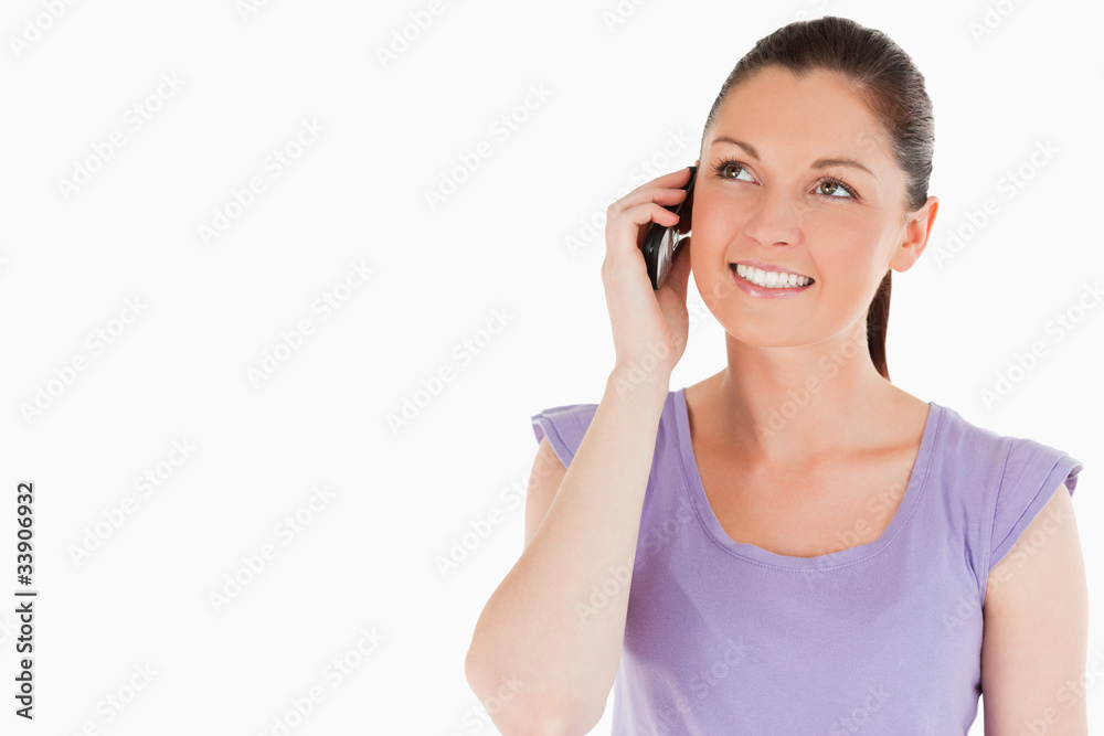 Attractive woman on the phone while standing Attractive woman on the phone while standing