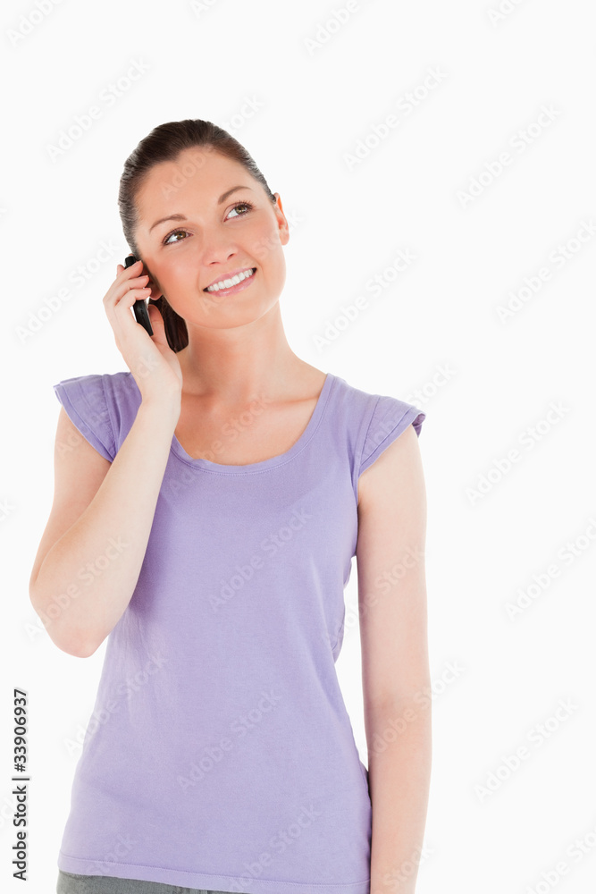 Good looking woman on the phone while standing Good looking woman on the phone while standing