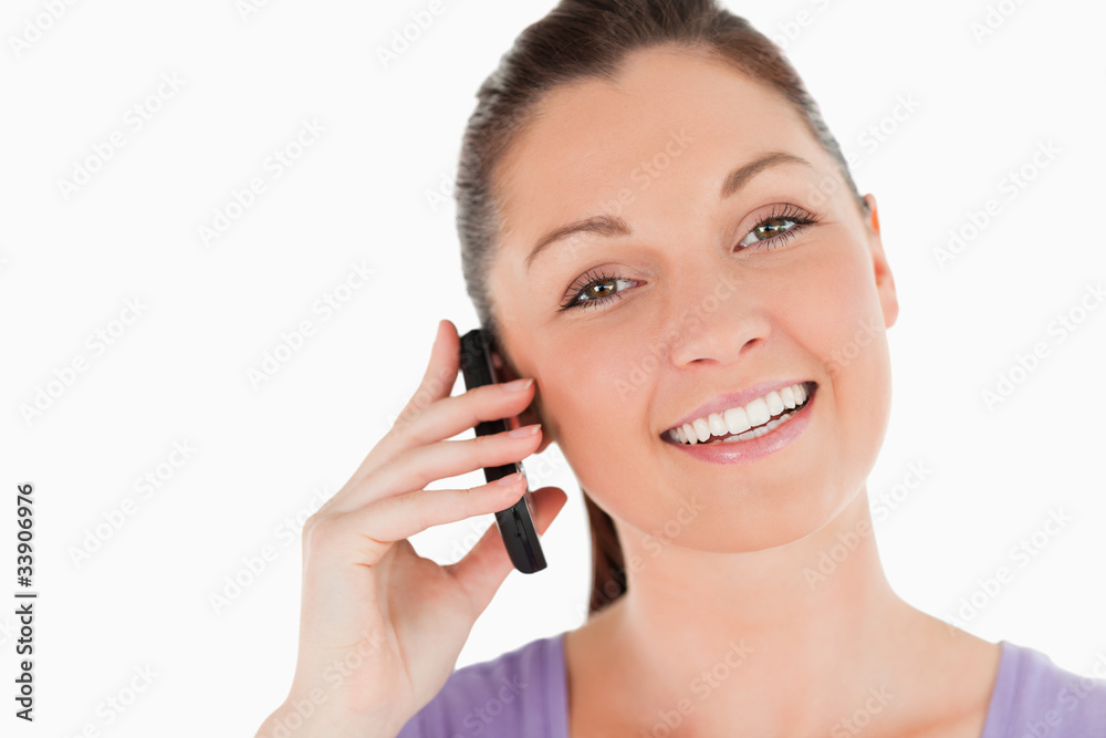 Portrait of an attractive woman on the phone while standing Portrait of an attractive woman on the phone while standing