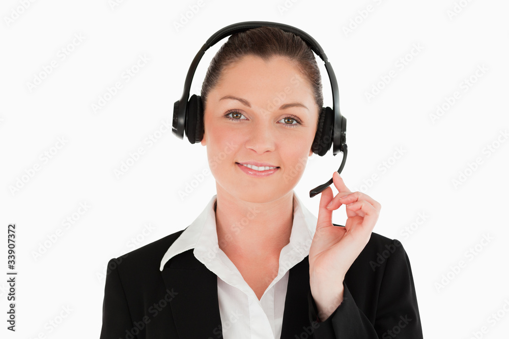 Portrait of a beautiful woman in suit using headphones and posin Portrait of a beautiful woman in suit using headphones and posin
