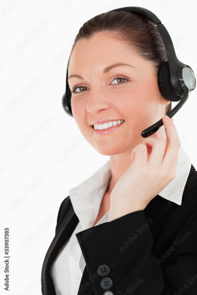 Portrait of a lovely woman in suit using headphones and posing Portrait of a lovely woman in suit using headphones and posing