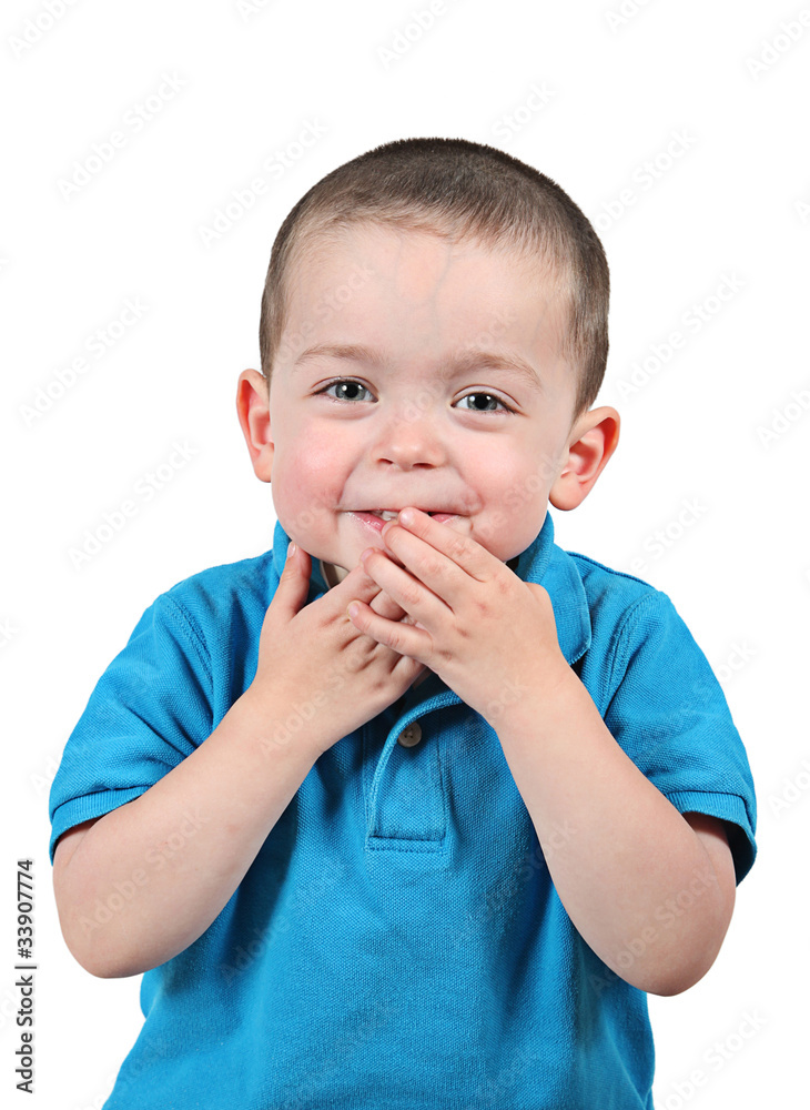 Cute little boy posing for camera on white background Cute little boy posing for camera on white background