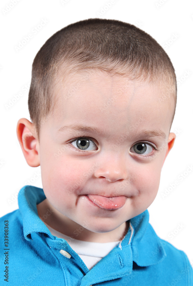 Cute little boy posing for camera on white background Cute little boy posing for camera on white background