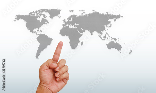 Hand pointing on world map