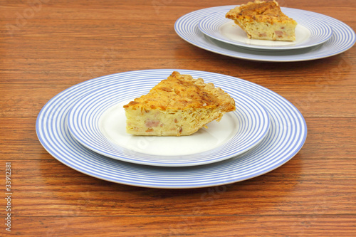 Servings of quiche lorraine on plates