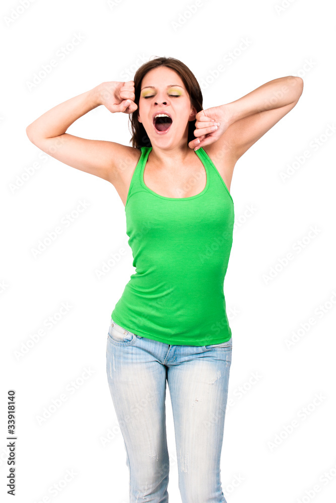 Woman in green top yawning and stretching herself Woman in green top yawning and stretching herself