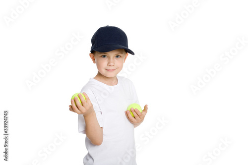 Smiling boy with tennis balls