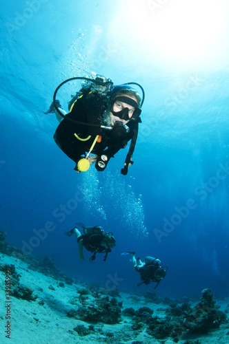 female scuba diver enjoys a dive in ocean