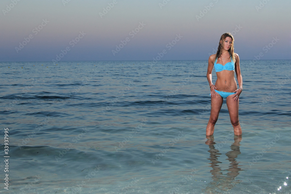 a beautiful woman relaxing on the beach