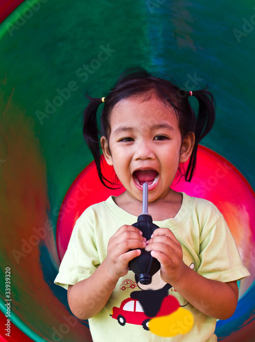 Children squeezed inflatable in colorful tunnel of the playgroun photo