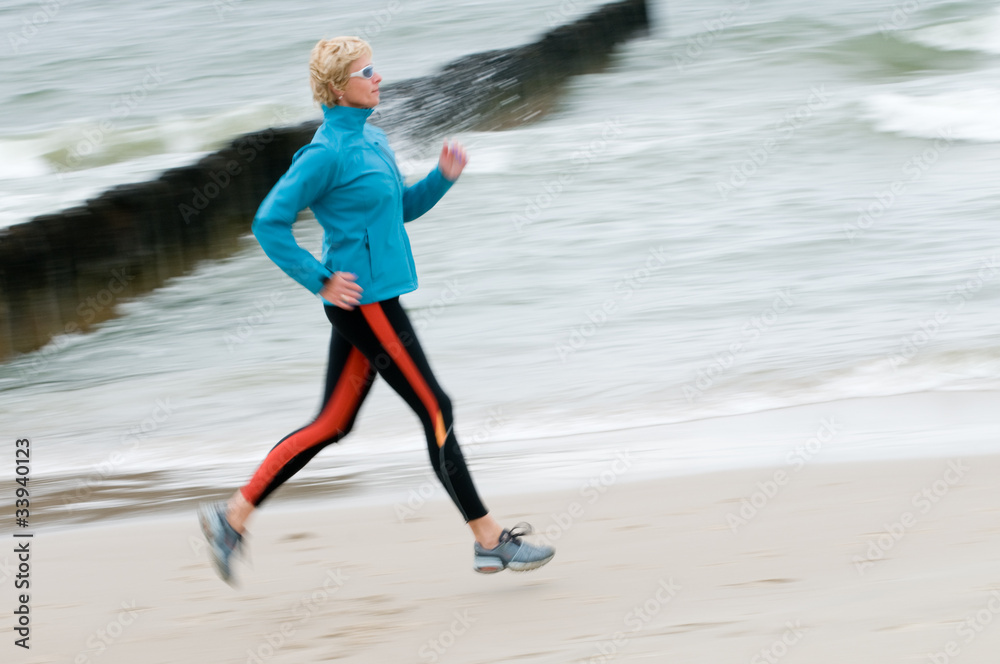 Woman running at the beach Woman running at the beach