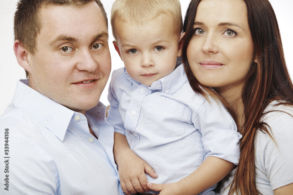 Happy beautiful family posing together on white background. Happy beautiful family posing together on white background.