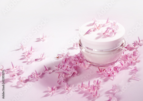 Cream and petals of pink flowers