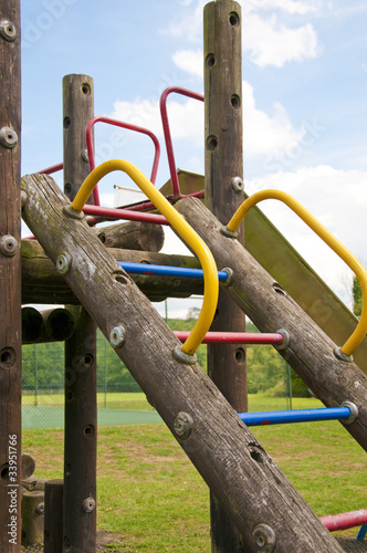 Childrens wooden climbing frame with coloufull handles & steps photo