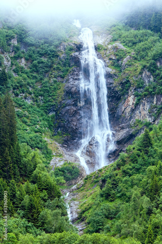 Alps waterfall summer view