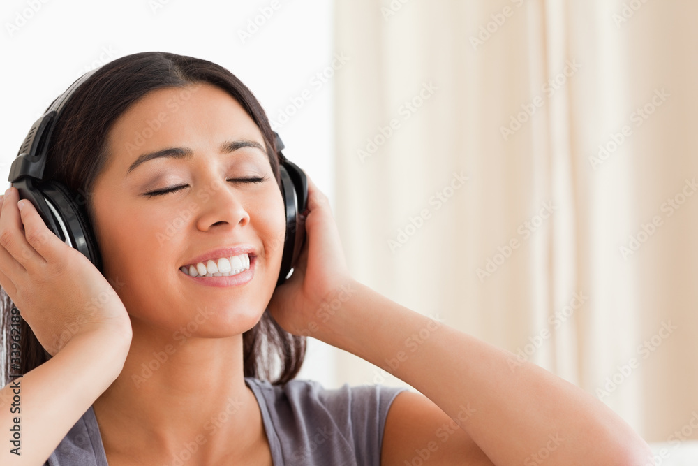 close up of woman with closed eyes and earphones close up of woman with closed eyes and earphones