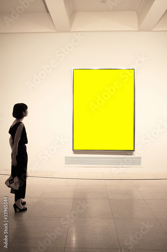 A women standing  before the painting