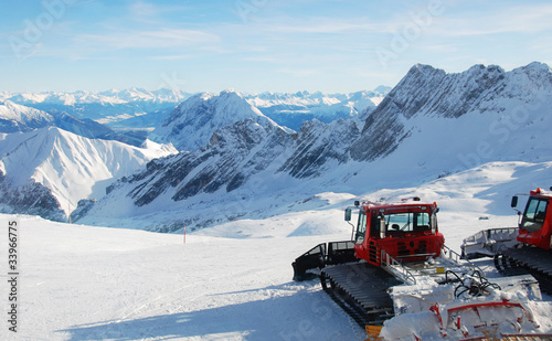 Bild auf Leinwand Snowcats Parked On Top Of Mountain