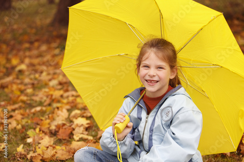 happy girl with yellow ubrella photo