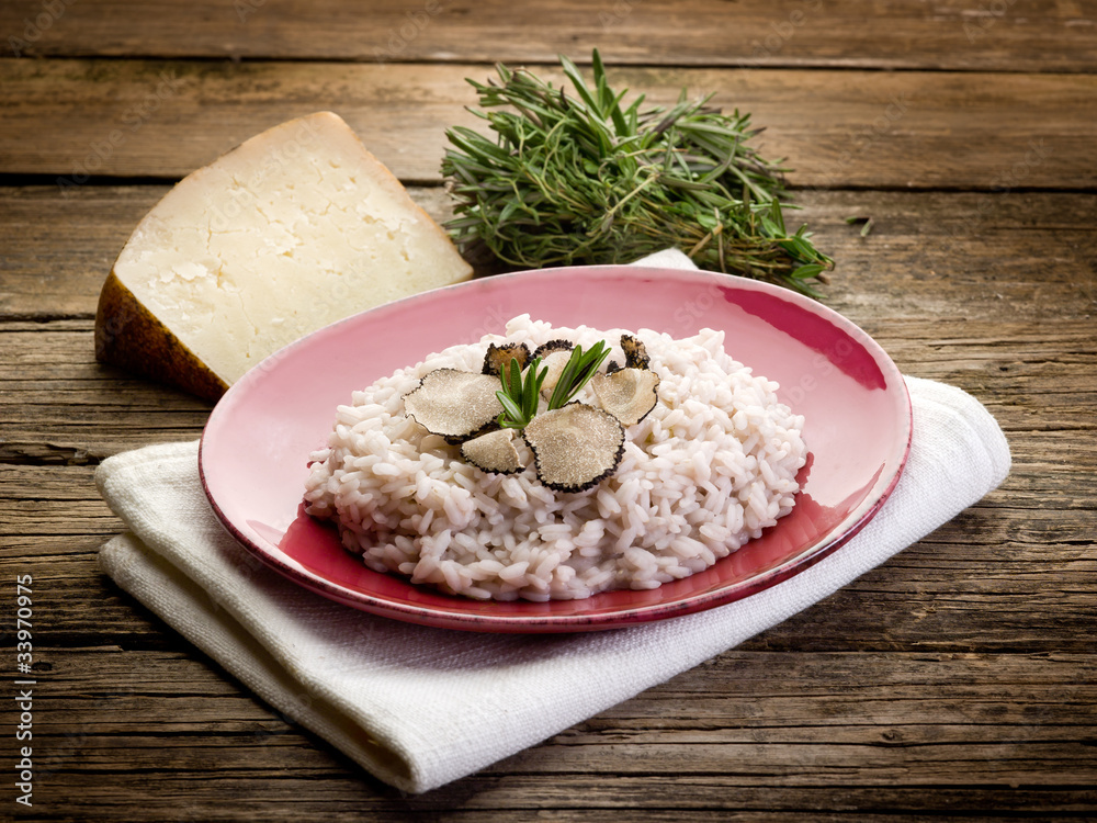 risotto with truffle over red dish risotto with truffle over red dish