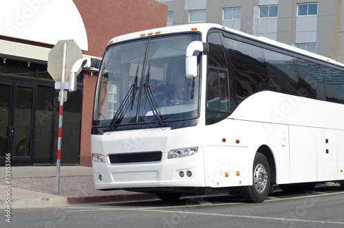 Tour bus coach parked outside venue