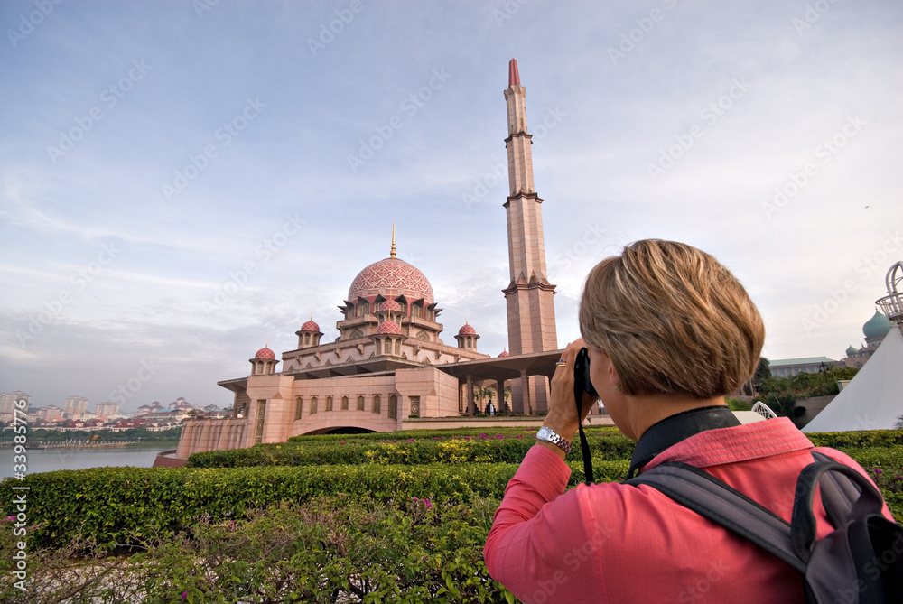 Fototapeta premium Tourist visiting Putrajaya Mosque in Kuala Lumpur
