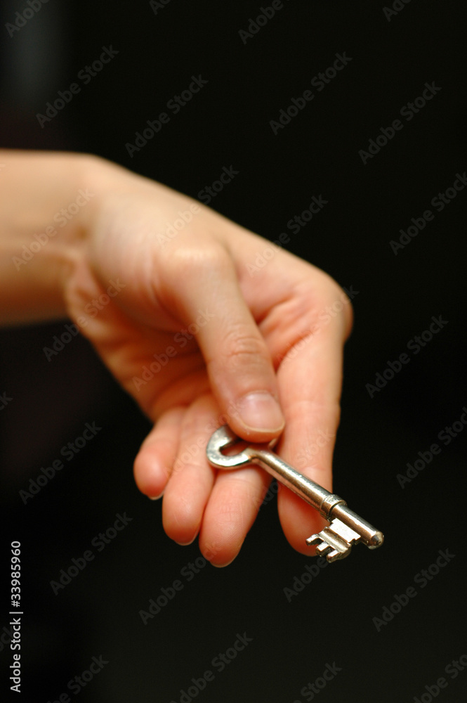 Hand holding a key