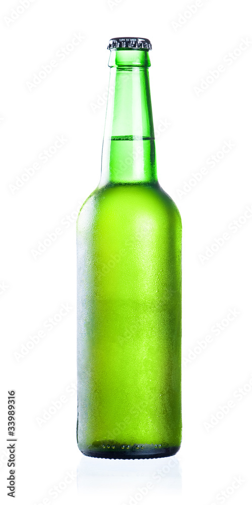 Cold chilled beer in green bottle with condensate isolated on a Cold chilled beer in green bottle with condensate isolated on a