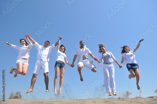 happy people group have fun and running on beach © .shock
