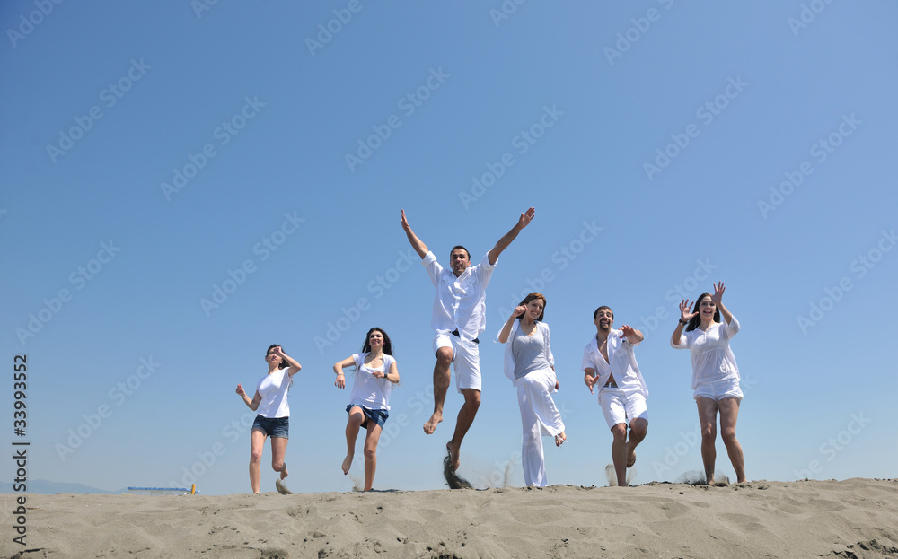 happy people group have fun and running on beach happy people group have fun and running on beach