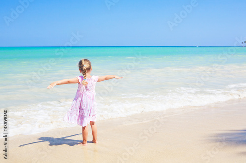 girl caribbean  beach outdoors arms wide open