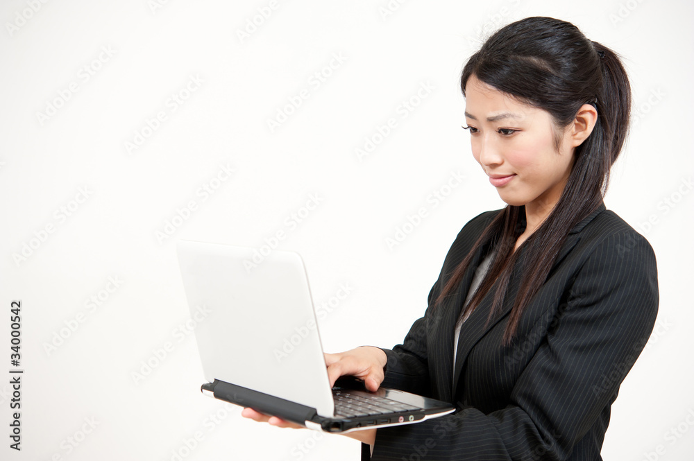 asian businesswoman using laptop computer asian businesswoman using laptop computer