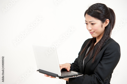asian businesswoman using laptop computer